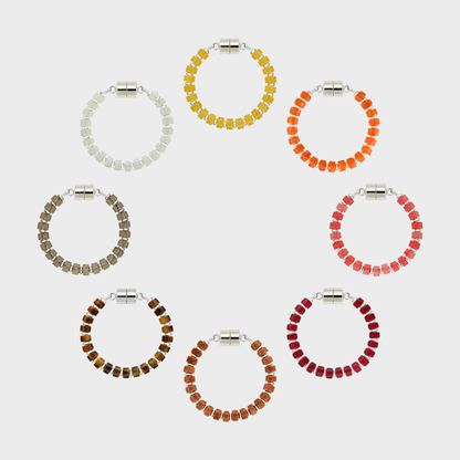 Equinox set of 8 magnetic wine charms arranged in a circle in Citrine, Mandarin Garnet, Red Carnelian, Ruby, Sunstone, Tiger Eye, Smoky Quartz and White Moonstone with silver hardware