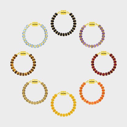 Haunted Manor set of 8 magnetic wine charms arranged in a circle in Black Onyx, Amethyst, Ruby, Mandarin Garnet, Citrine, Smoky Quartz, Tiger Eye and Opal with gold hardware