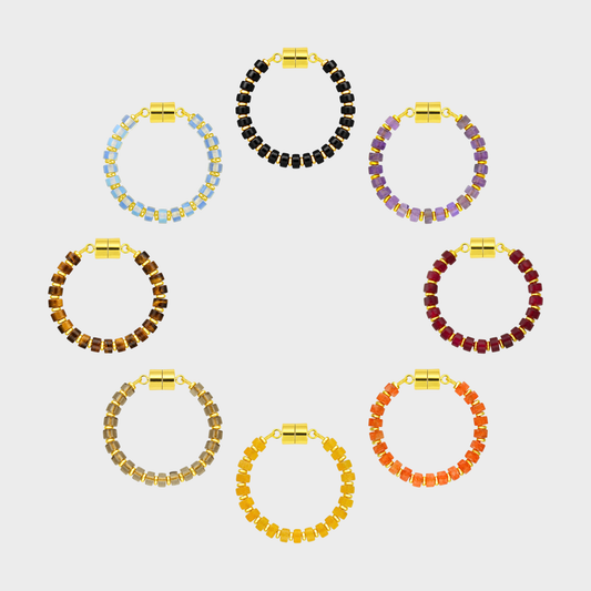Haunted Manor set of 8 magnetic wine charms arranged in a circle in Black Onyx, Amethyst, Ruby, Mandarin Garnet, Citrine, Smoky Quartz, Tiger Eye and Opal with gold hardware