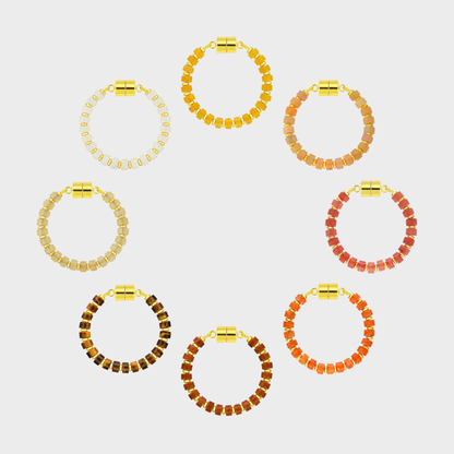 Heirloom set of 8 magnetic wine charms arranged in a circle in Citrine, Peach Aventurine, Red Carnelian, Mandarin Garnet, Sunstone, Tiger Eye, Champagne Zircon and White Moonstone with gold hardware