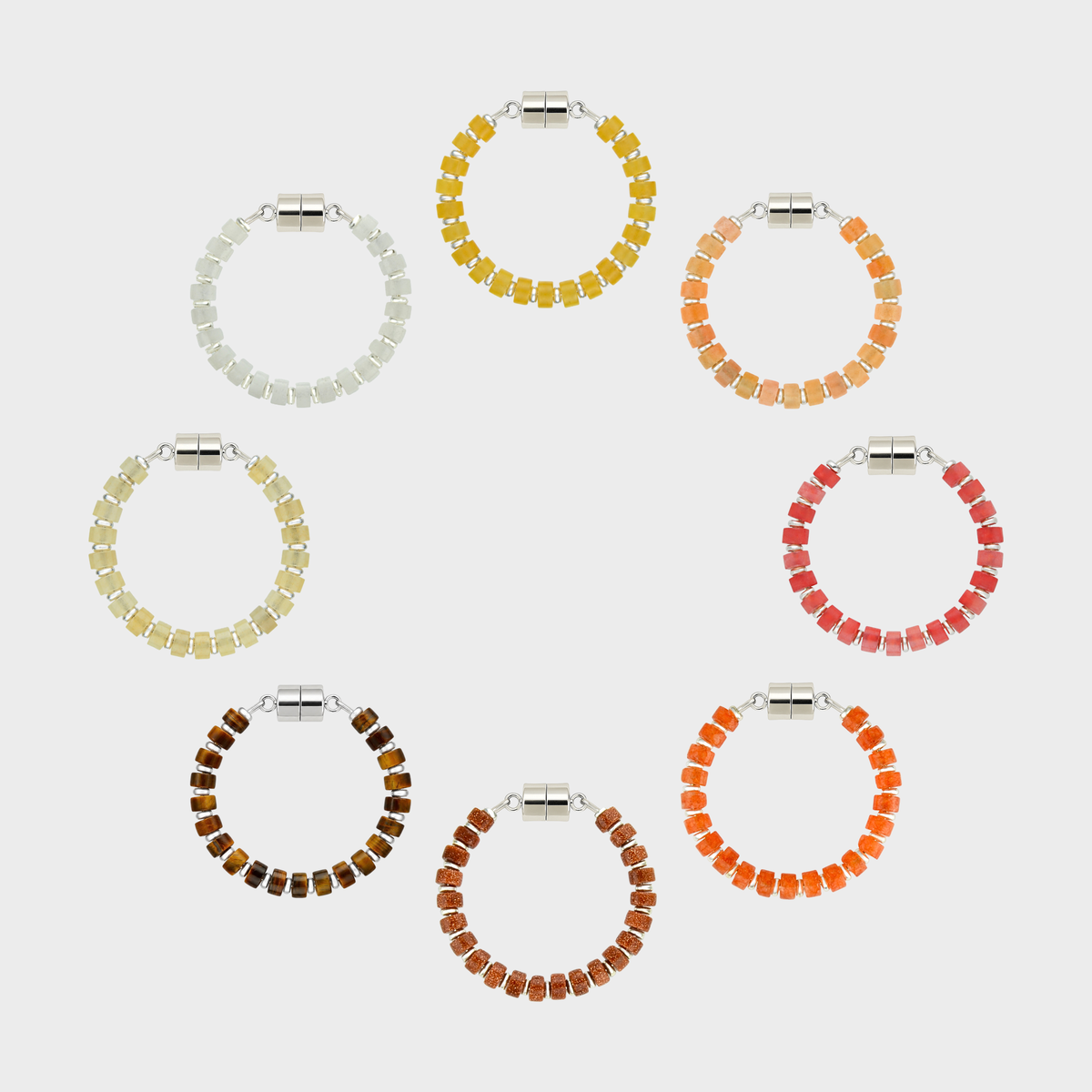 Heirloom set of 8 magnetic wine charms arranged in a circle in Citrine, Peach Aventurine, Red Carnelian, Mandarin Garnet, Sunstone, Tiger Eye, Champagne Zircon and White Moonstone with silver hardware