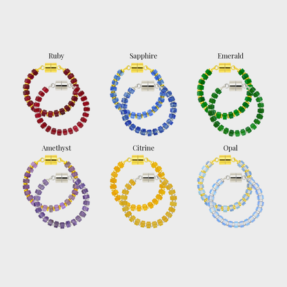 Coronation set of 6 magnetic wine charms in gold and silver showing each color name: Ruby, Sapphire, Emerald, Amethyst, Citrine and Opal