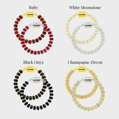 Crimson & White wine charm set showing each color name: Ruby, White Moonstone, Black Onyx and Champagne Zircon