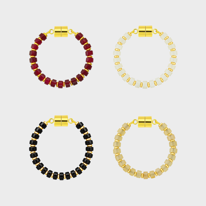 Crimson & White set of 4 magnetic wine charms in Ruby, White Moonstone, Black Onyx and Champagne Zircon with gold hardware