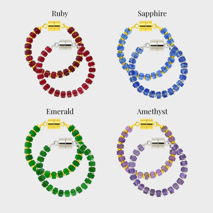 Crown Jewels set of 4 magnetic wine charms in gold and silver showing each color name: Ruby, Sapphire, Emerald and Amethyst
