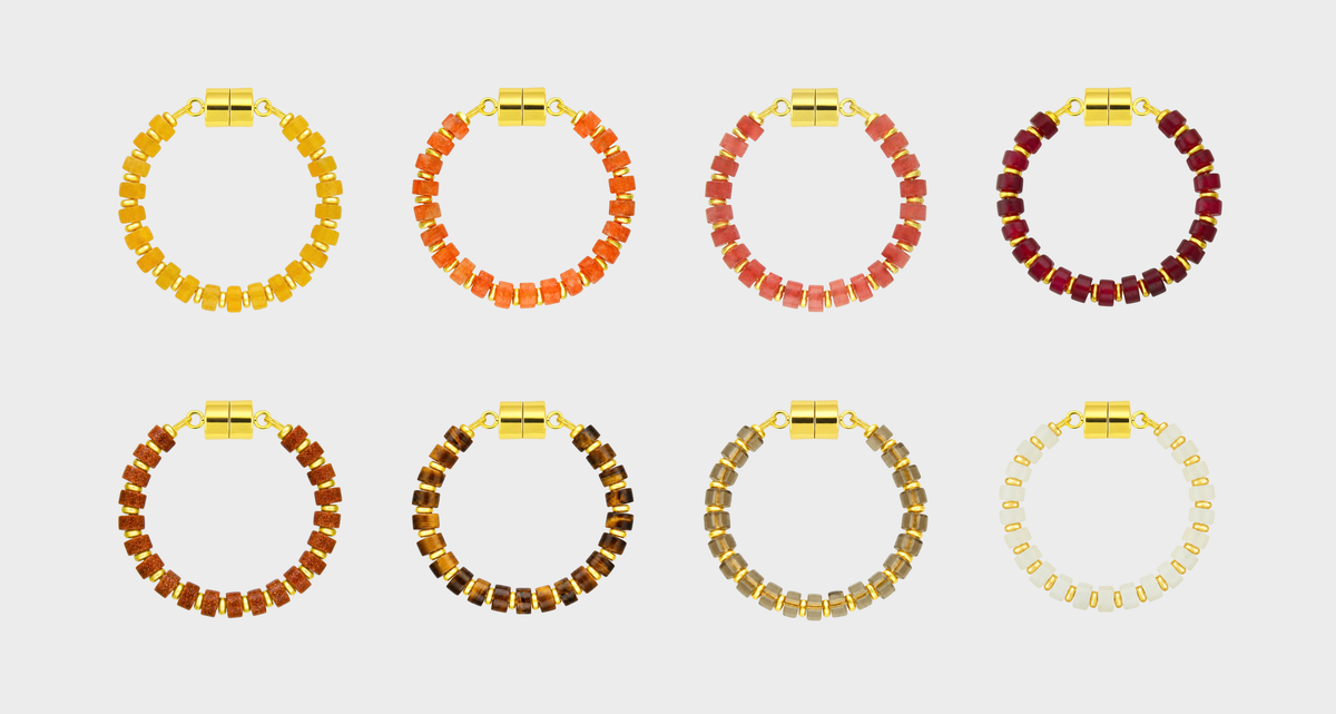Equinox set of 8 magnetic wine charms in Citrine, Mandarin Garnet, Red Carnelian, Ruby, Sunstone, Tiger Eye, Smoky Quartz and White Moonstone with gold hardware