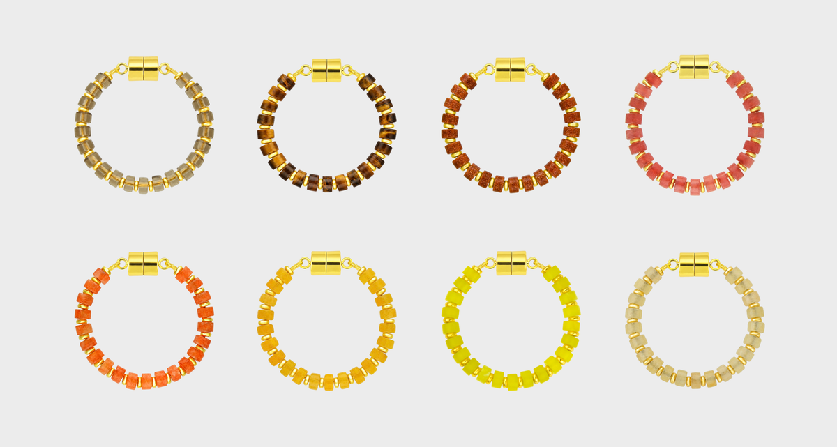 Golden Hour Ombré set of 8 magnetic wine charms in Smoky Quartz, Tiger's Eye, Sunstone, Red Carnelian, Mandarin Garnet, Citrine, Lemon Quartz and Champagne Zircon with gold hardware