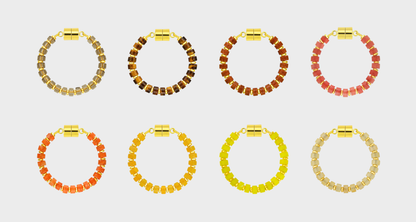 Golden Hour Ombré set of 8 magnetic wine charms in Smoky Quartz, Tiger's Eye, Sunstone, Red Carnelian, Mandarin Garnet, Citrine, Lemon Quartz and Champagne Zircon with gold hardware