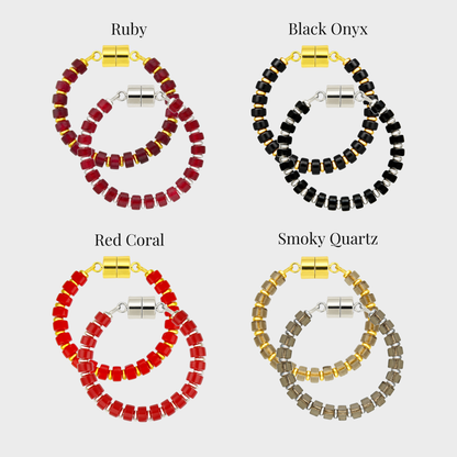 Midnight Bite wine charm set showing each color name: Ruby, Black Onyx, Red Coral and Smoky Quartz