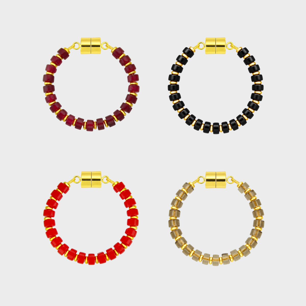 Midnight Bite set of 4 magnetic wine charms in Ruby, Black Onyx, Red Coral and Smoky Quartz with gold hardware