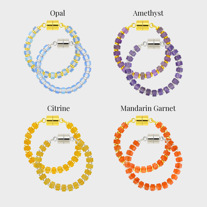 Spellbound set of 4 magnetic wine charms in gold and silver showing each color name: Opal, Amethyst, Citrine and Mandarin Garnet