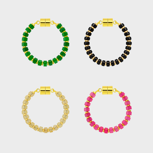 Supper Club set of 4 magnetic wine charms in Emerald, Black Onyx, Champagne Zircon and Pink Spinel with gold hardware