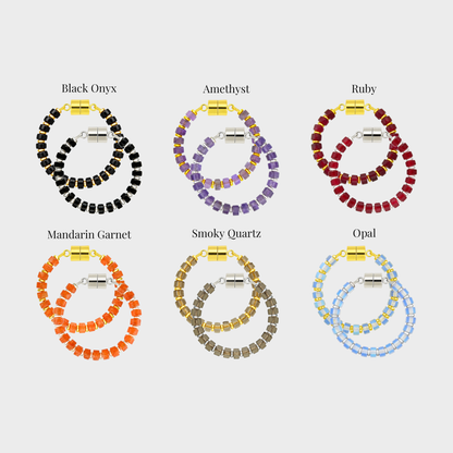 Witching Hour wine charm set showing each color name: Black Onyx, Amethyst, Ruby, Mandarin Garnet, Smoky Quartz and Opal