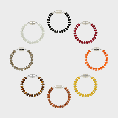 Nightfall set of 8 magnetic wine charms arranged in a circle in Black Onyx, Ruby, Mandarin Garnet, Citrine, Sunstone, Tiger Eye, Smoky Quartz and White Moonstone with silver hardware