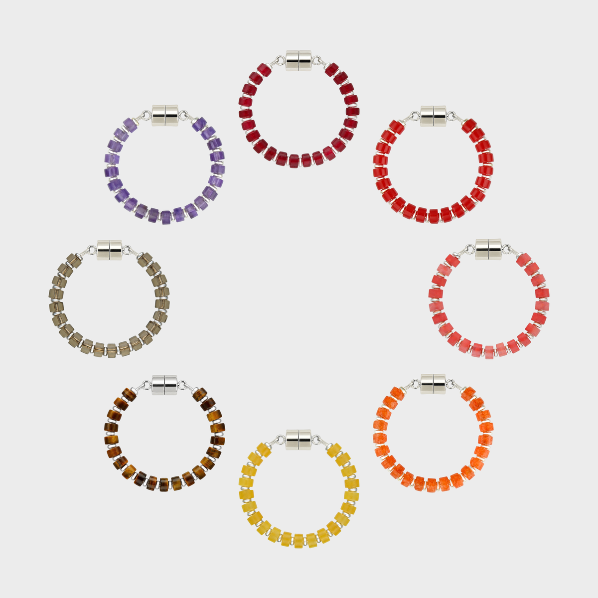 Reserve set of 8 magnetic wine charms arranged in a circle in Ruby, Red Coral, Red Carnelian, Mandarin Garnet, Citrine, Tiger Eye, Smoky Quartz and Amethyst with silver hardware