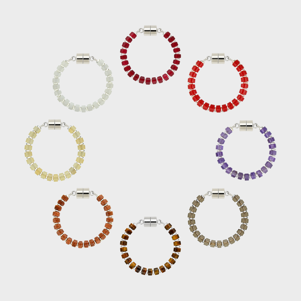 Vintner set of 8 magnetic wine charms arranged in a circle in Ruby, Red Coral, Amethyst, Smoky Quartz, Tiger Eye, Sunstone, Champagne Zircon and White Moonstone with silver hardware