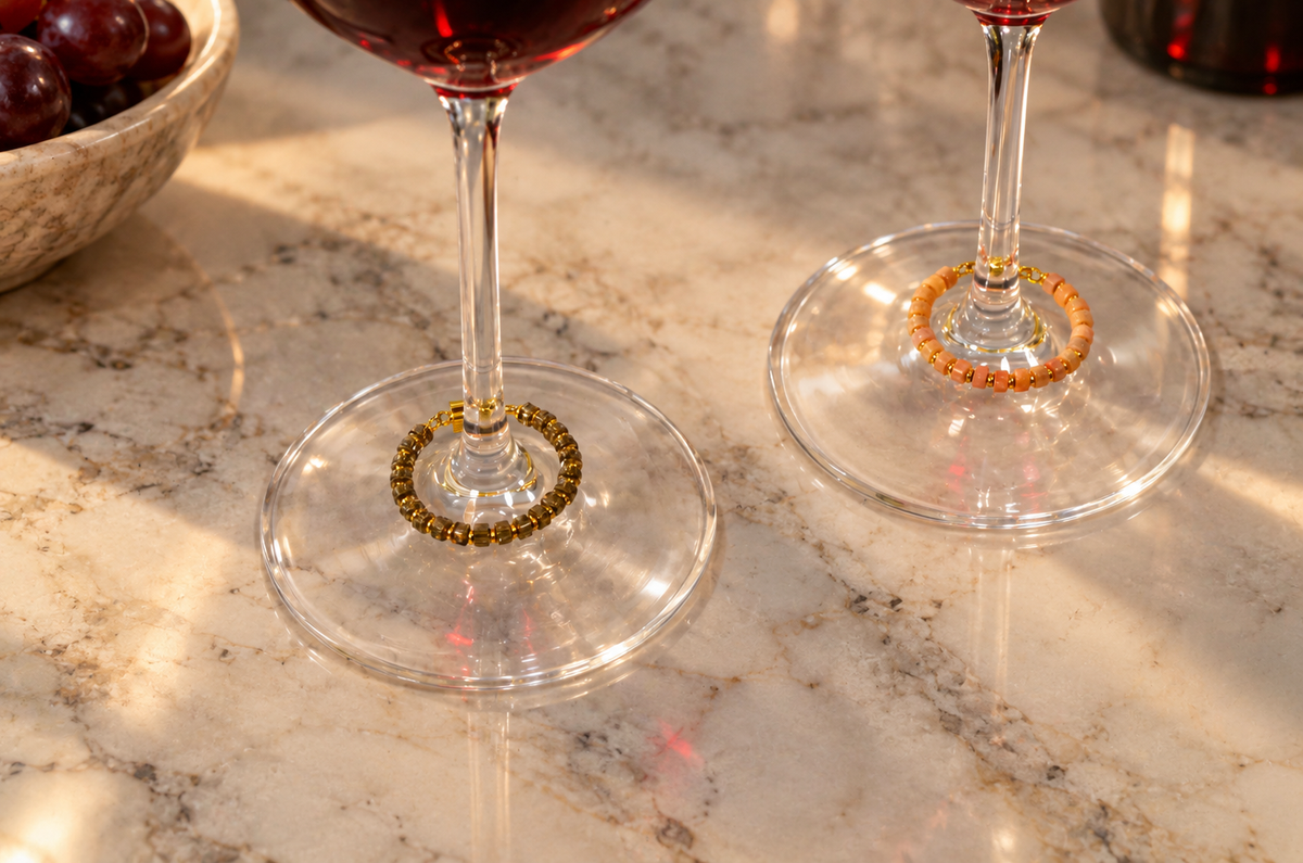 Magnetic wine charms by House of Hez displayed on wine glasses