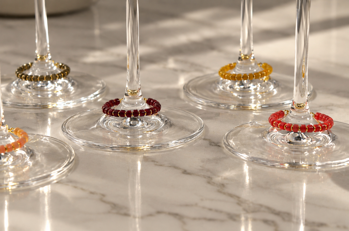 Set of six magnetic wine charms by House of Hez displayed on wine glasses